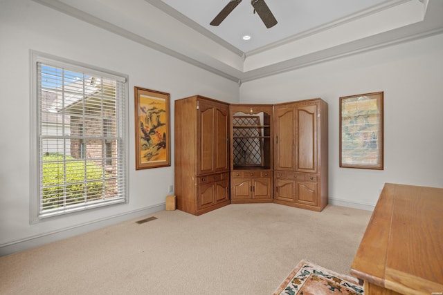 bedroom featuring crown molding, baseboards, visible vents, and light colored carpet