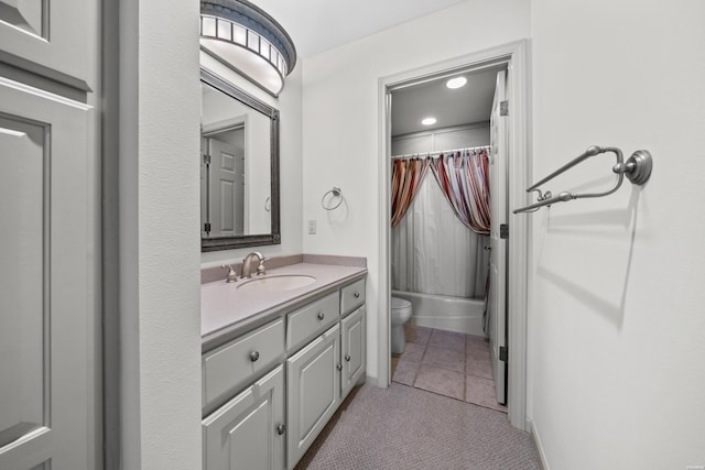 bathroom with toilet, shower / tub combo, vanity, tile patterned flooring, and baseboards