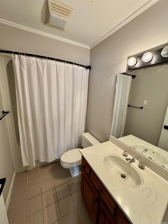 bathroom with tile patterned flooring, vanity, visible vents, ornamental molding, and shower / bath combo with shower curtain