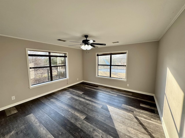 empty room with plenty of natural light, baseboards, and dark wood-style flooring