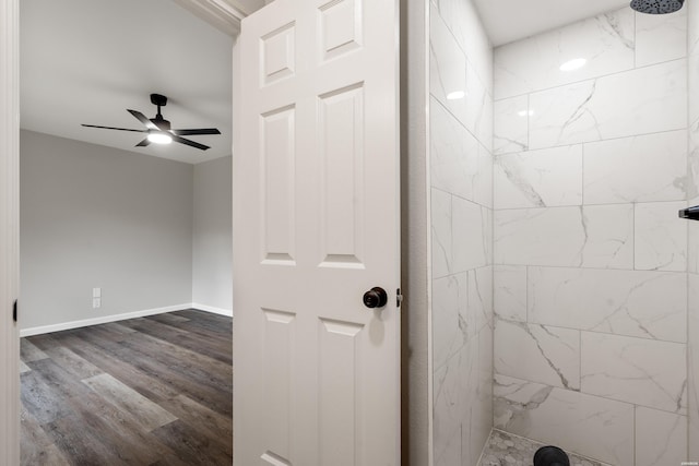 401 Buttrum Rd, Royal, AR 71968 - bathroom with tiled shower, wood finished floors, and a ceiling fan