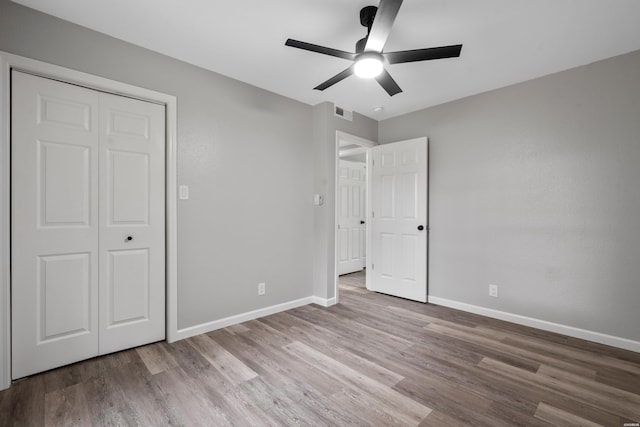 401 Buttrum Rd, Royal, AR 71968 - unfurnished bedroom with wood finished floors and ceiling fan