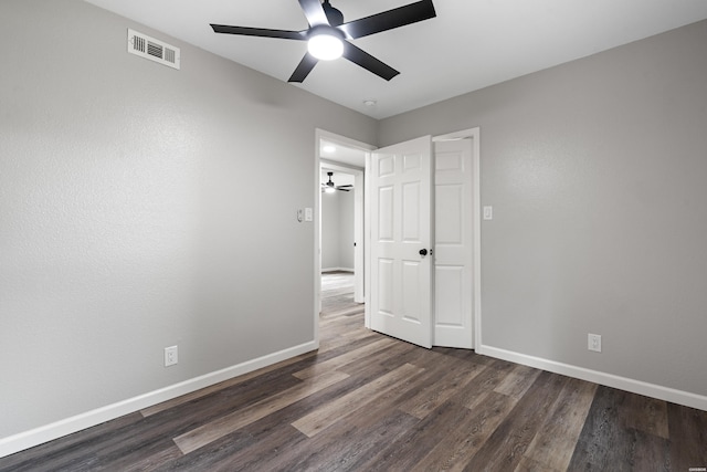 401 Buttrum Rd, Royal, AR 71968 - unfurnished bedroom featuring dark wood-style floors and a ceiling fan