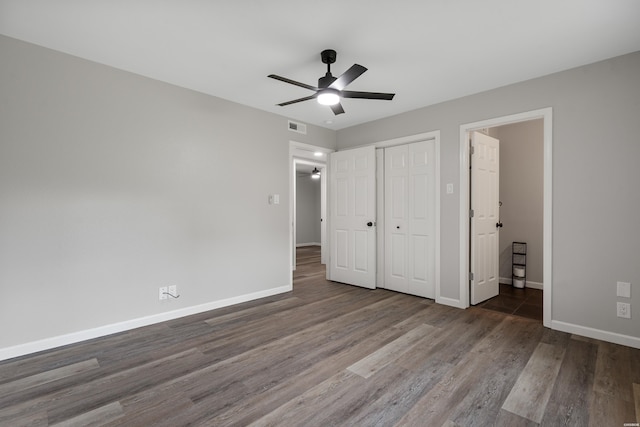 401 Buttrum Rd, Royal, AR 71968 - unfurnished bedroom featuring wood finished floors, a closet, and ceiling fan