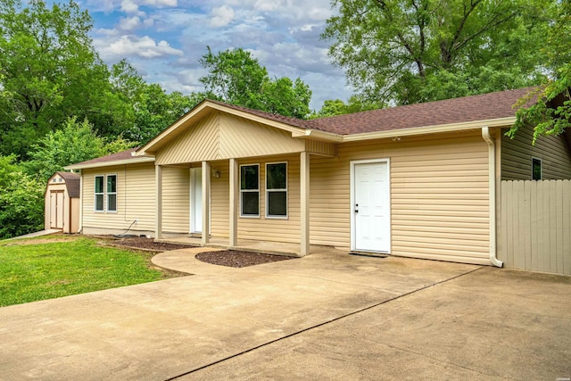 401 Buttrum Rd, Royal, AR 71968 - ranch-style house with a shed, roof with shingles, a patio, and covered porch