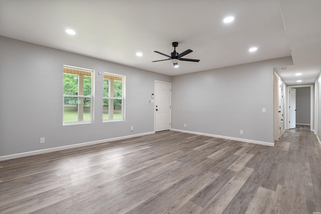 401 Buttrum Rd, Royal, AR 71968 - unfurnished living room featuring ceiling fan, wood finished floors, and recessed lighting