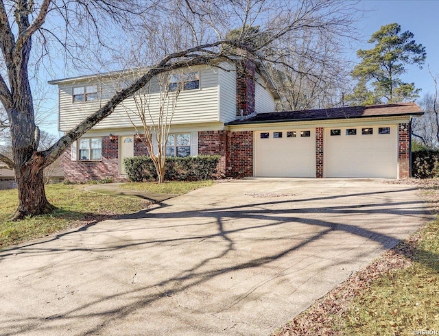 view of front of property with driveway, brick siding, and an attached garage