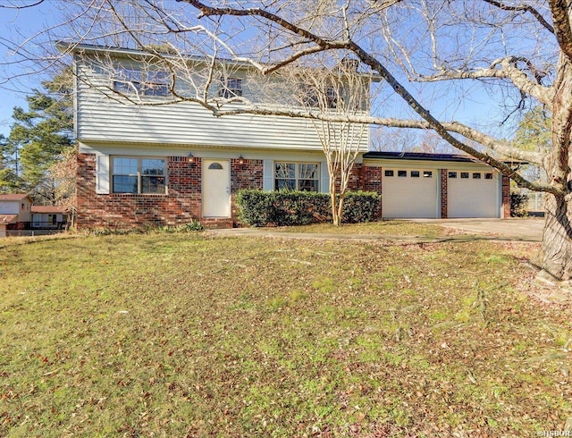 colonial house featuring a garage, driveway, brick siding, and a front lawn