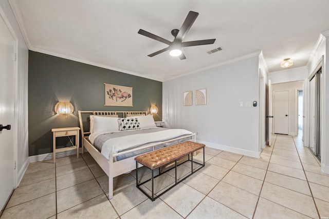 bedroom with visible vents, a ceiling fan, crown molding, light tile patterned floors, and baseboards