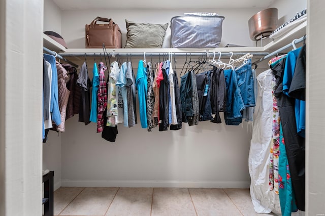 spacious closet featuring tile patterned floors