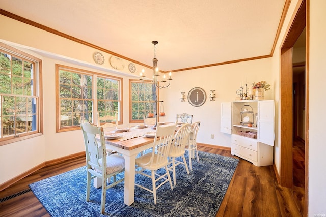 dining area featuring baseboards, visible vents, ornamental molding, dark wood-style flooring, and an inviting chandelier