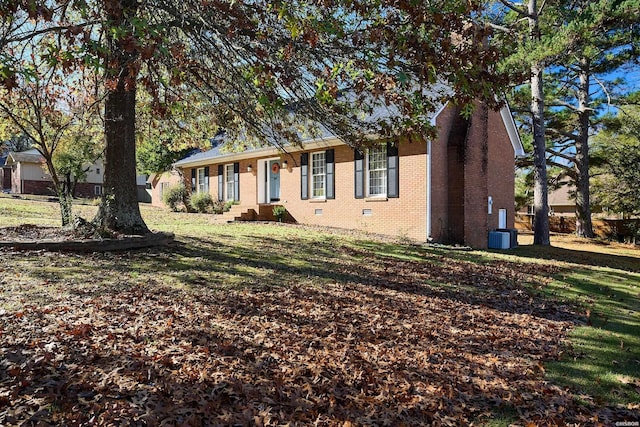 ranch-style house with crawl space, brick siding, and central AC