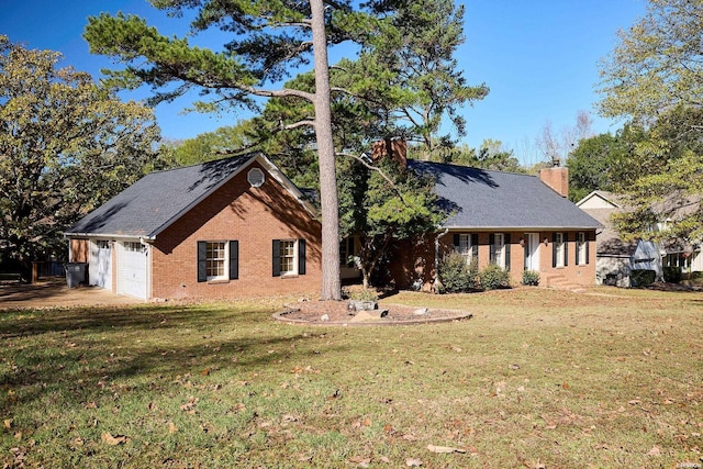 view of front of property with concrete driveway, a chimney, an attached garage, a front yard, and brick siding