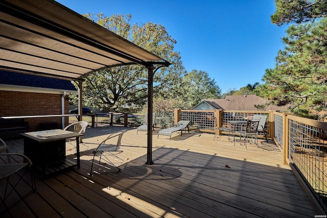 wooden deck featuring outdoor dining space