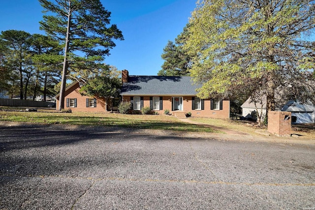 view of front of house with a chimney