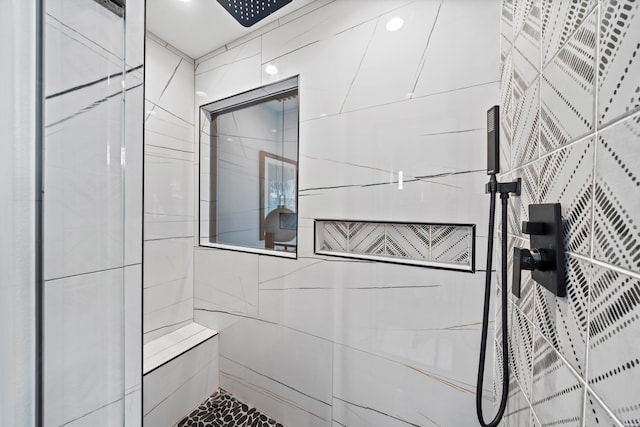 bathroom with tiled shower