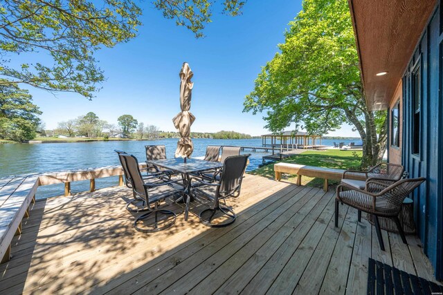 wooden deck with a water view