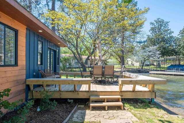 wooden terrace with a water view