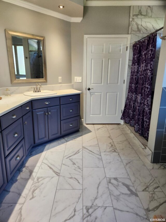 bathroom featuring marble finish floor, a shower with curtain, crown molding, and vanity