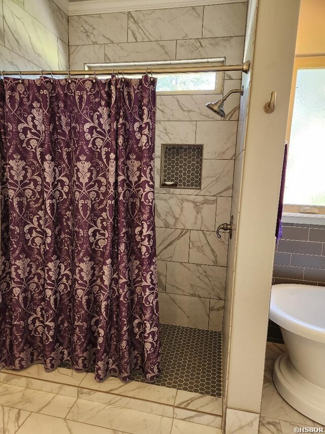 full bath with marble finish floor and curtained shower