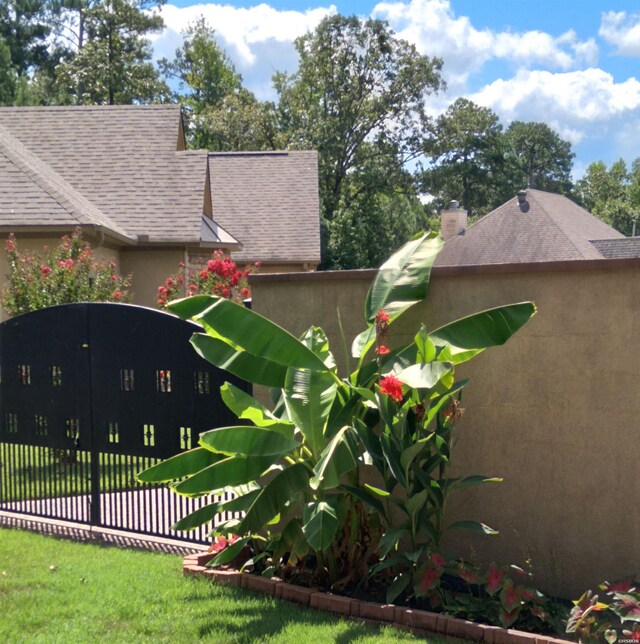 exterior space featuring fence and a lawn