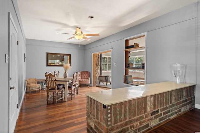 office with wood finished floors and a ceiling fan