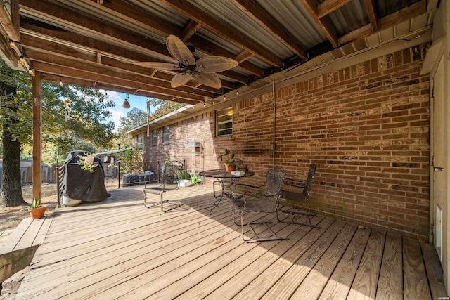 wooden deck featuring a trampoline and a ceiling fan