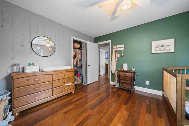 bedroom featuring a ceiling fan, baseboards, and hardwood / wood-style flooring