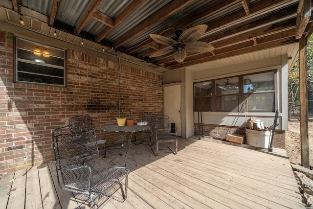 wooden terrace with a ceiling fan