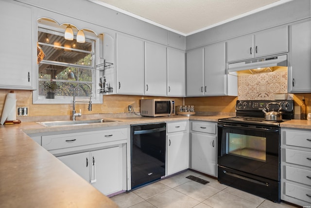 kitchen featuring under cabinet range hood, black appliances, light countertops, and a sink