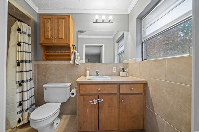 bathroom featuring toilet, tile walls, ornamental molding, and vanity