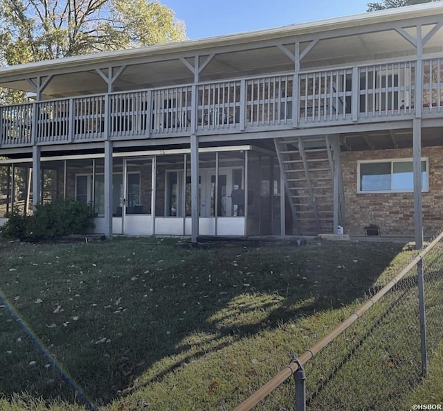115 Ledgerock Rd, Hot Springs, AR 71913 - rear view of house with a yard, a sunroom, brick siding, and a deck
