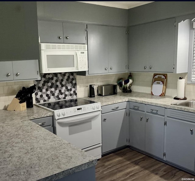 115 Ledgerock Rd, Hot Springs, AR 71913 - kitchen with white appliances, decorative backsplash, dark wood finished floors, and light countertops