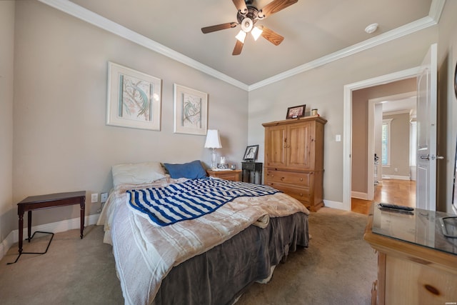 bedroom featuring crown molding, light carpet, baseboards, and ceiling fan