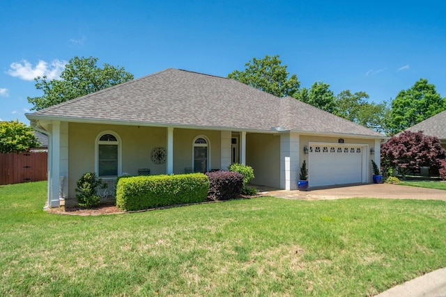 ranch-style home featuring roof with shingles, a garage, stucco siding, and a front lawn