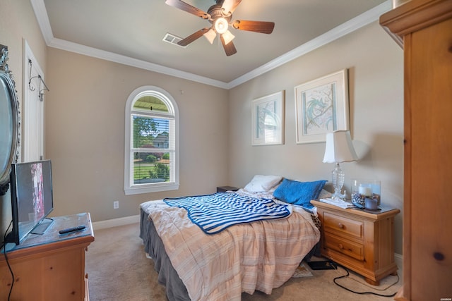 bedroom featuring a ceiling fan, baseboards, visible vents, crown molding, and light colored carpet