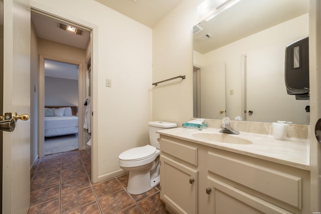 5371 Central Ave Unit 5D, Hot Springs, AR 71913 - bathroom with tile patterned flooring, toilet, connected bathroom, visible vents, and vanity