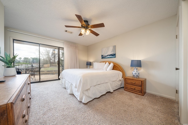 5371 Central Ave Unit 5D, Hot Springs, AR 71913 - bedroom with light colored carpet, visible vents, a textured ceiling, access to outside, and baseboards