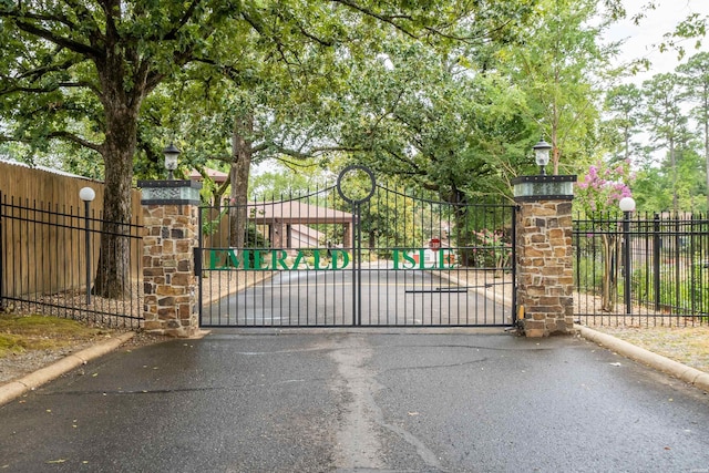 view of gate with fence