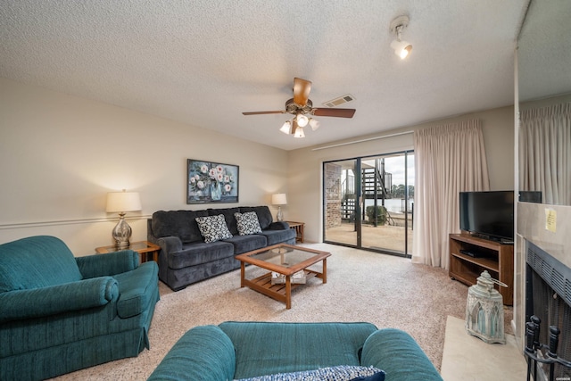 5371 Central Ave Unit 5D, Hot Springs, AR 71913 - living area with a ceiling fan, light colored carpet, visible vents, and a textured ceiling