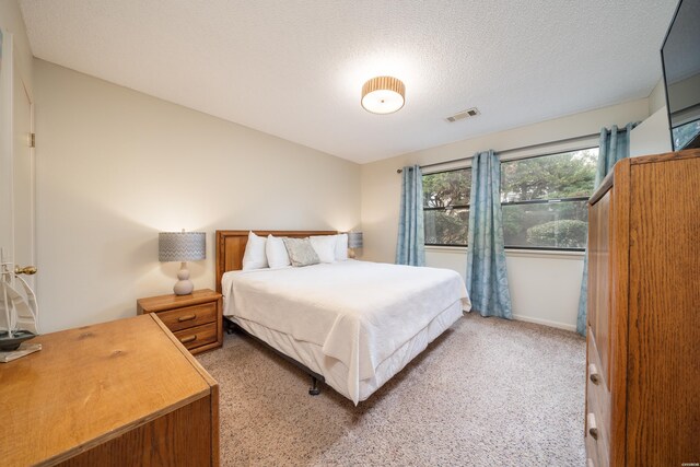 5371 Central Ave Unit 5D, Hot Springs, AR 71913 - bedroom with a textured ceiling, light carpet, and visible vents