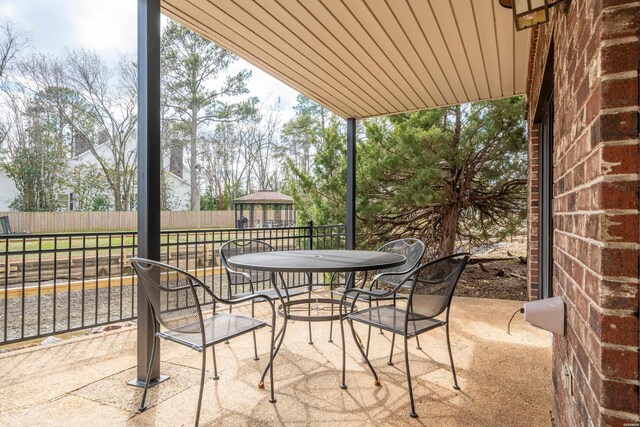5371 Central Ave Unit 5D, Hot Springs, AR 71913 - view of patio with outdoor dining space, fence, and a gazebo