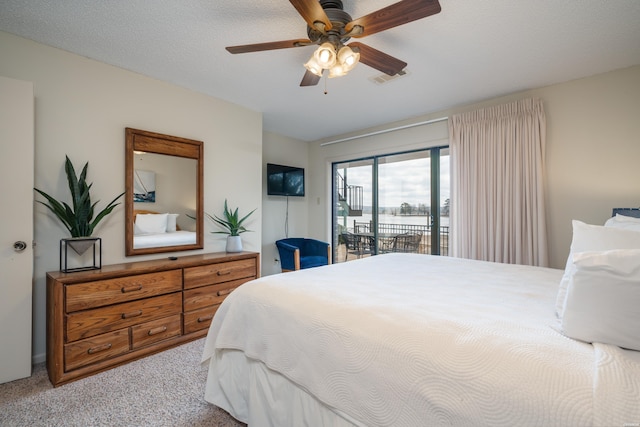 5371 Central Ave Unit 5D, Hot Springs, AR 71913 - carpeted bedroom with access to outside, a textured ceiling, visible vents, and a ceiling fan