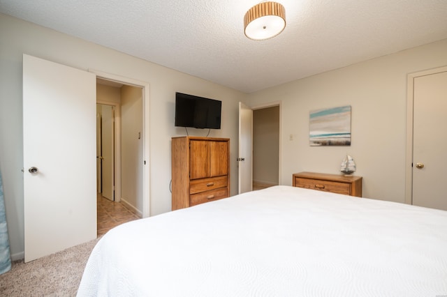 5371 Central Ave Unit 5D, Hot Springs, AR 71913 - bedroom with light colored carpet and a textured ceiling