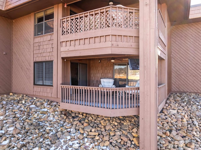 view of side of home with a balcony