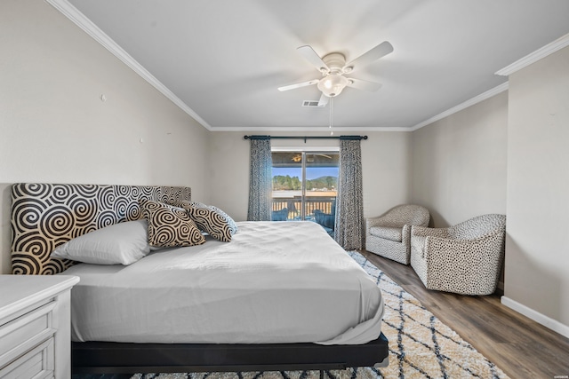 bedroom with baseboards, visible vents, ornamental molding, wood finished floors, and access to outside