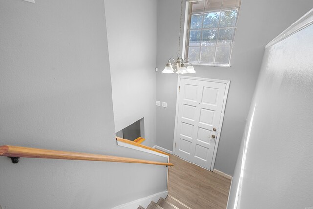102 Brandiles Ln, Hot Springs, AR 71913 - staircase featuring a notable chandelier, baseboards, and wood finished floors