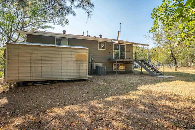 102 Brandiles Ln, Hot Springs, AR 71913 - rear view of house with stairway and cooling unit