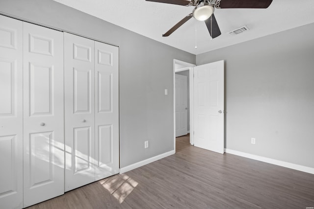 102 Brandiles Ln, Hot Springs, AR 71913 - unfurnished bedroom featuring ceiling fan, wood finished floors, visible vents, baseboards, and a closet
