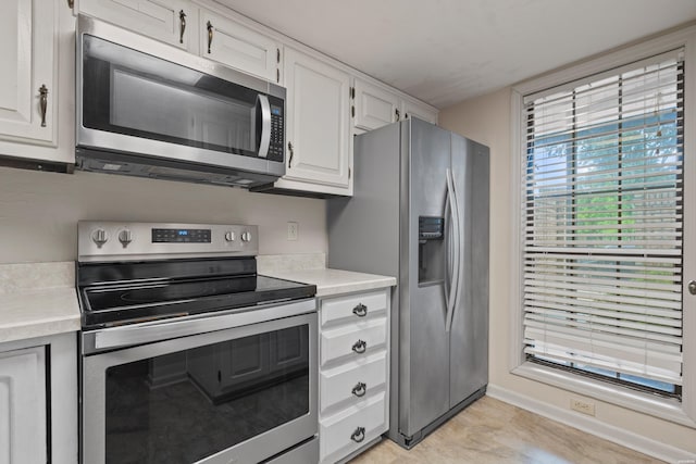 12 Beldoir Ct Unit 12, Hot Springs, AR 71901 - kitchen with appliances with stainless steel finishes, light countertops, and white cabinets